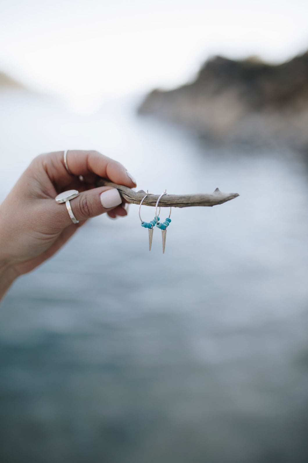Sterling silver hoops earrings with sterling silver studs and turquoise nuggets.                          ets 