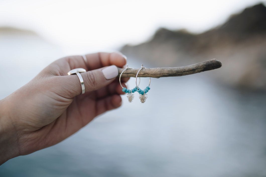 Sterling silver hoops earrings with sterling silver pinecones and turquoise nuggets.                          ets 