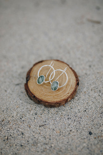 Serpentine stones set on sterling silver hoops. All handmade.                            