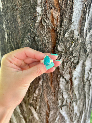 Mexico mined White Water Turquoise stone set on a sterling silver band. This ring is a size 9 and is a statement ring. 