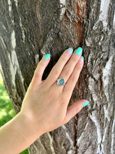Load image into Gallery viewer, Photo showing the blue kyanite ring on my finger.
